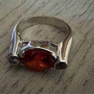Radiant Silver Ring with Fiery Amber Gem